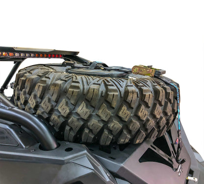 Spare tire storage bag sitting inside inverted off road wheel