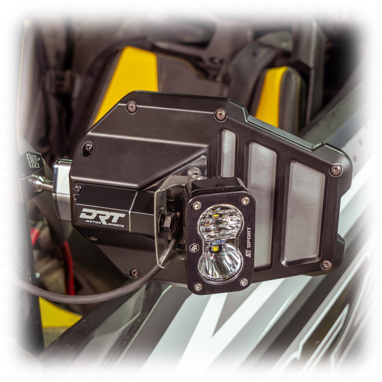 Tactical mirror light bracket kit installed on UTV mirror with light mounted