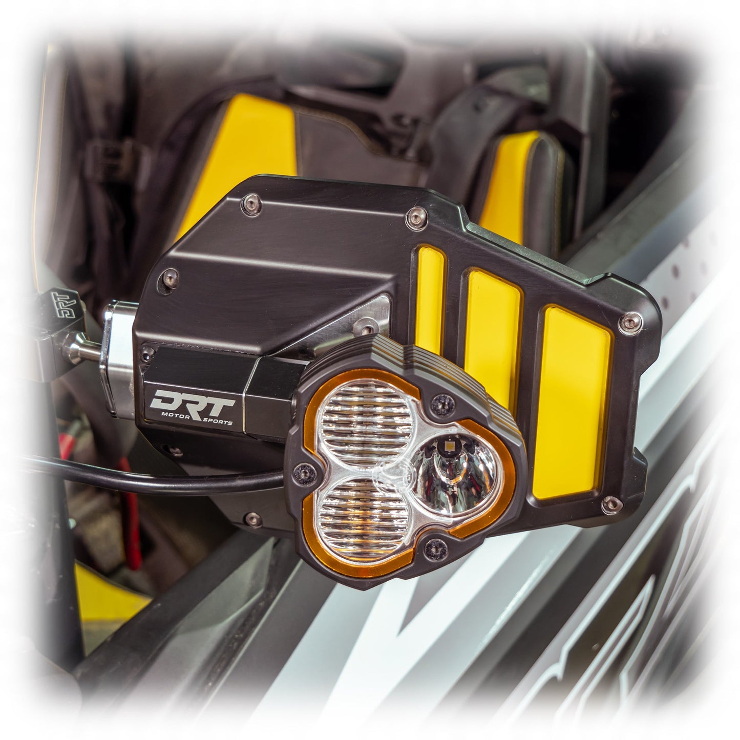 Tactical mirror light bracket kit installed on UTV mirror with light mounted