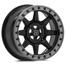 Black alloy wheel with gray beadlock and a visible brand logo on a white background